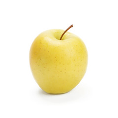 Golden Delicious apple on a white background