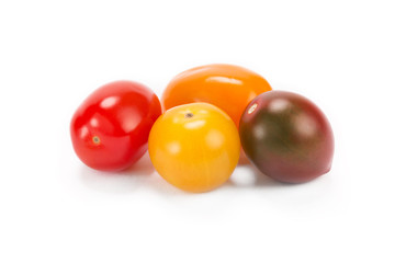 Multicolored cherry tomatoes isolated on white background 