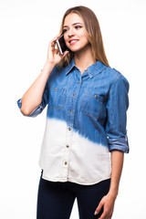 side view of a young casual woman speaking on the phone