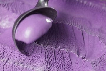 scooping violet ice cream close up shot shallow focus