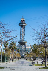 BARCELONA, SPAIN - FEBRUARY 12, 2014: A park in Barcelona and a cable car station on the background, Spain.