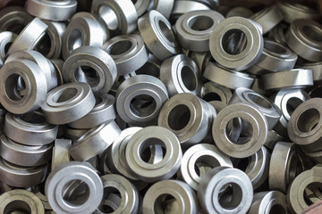 A pile of billets of steel parts in the workshop of the machine factory.