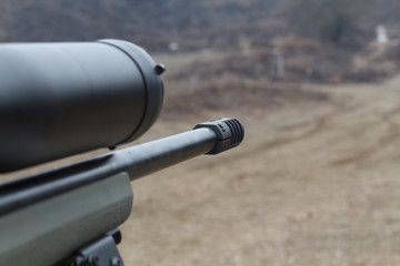 Sniper rifle. Optical sight. Shooting at the dash.