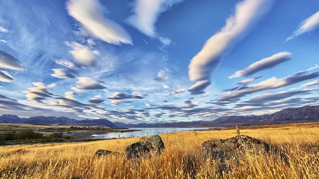 Lenticular Clouds Hover over Lake and Mountain Alpine Landscape Timelapse