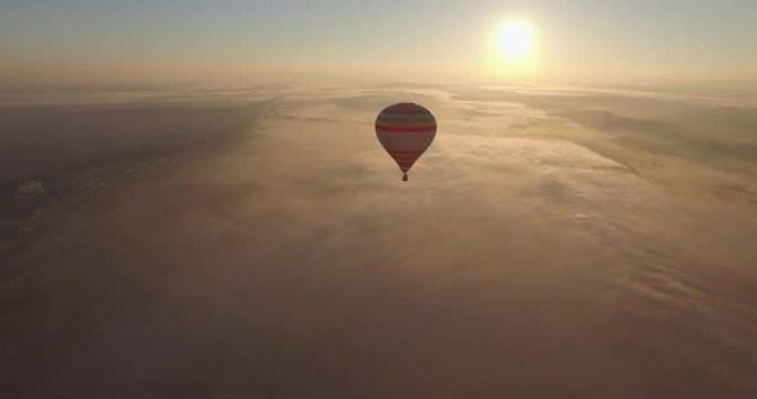 Aerial view of Hot air balloon floating in the pure blue sky on the sunrise