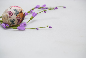 Easter egg with purple flowers. Decoupage. DIY