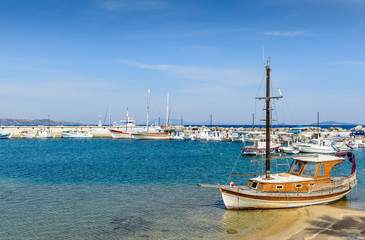 Naklejka na ściany i meble The picturesque Harbor with fishing boats in a sunny summer day, Kefalos village, Kos island, Dodecanese, Greece 
