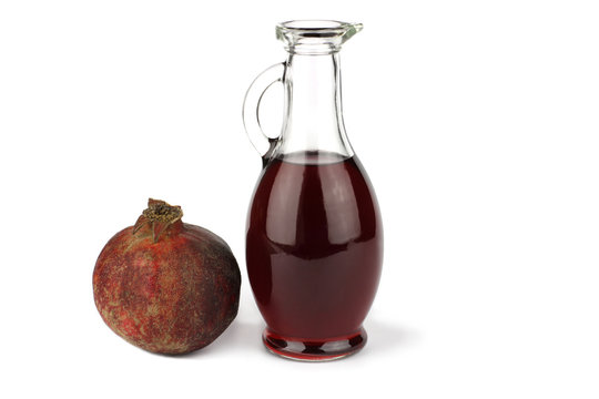 Garnet vinegar and whole pomegranate