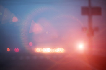 Photo of blurred street lights in evening
