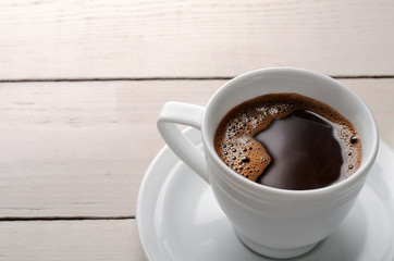 black coffee on a wooden table