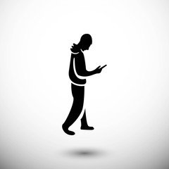 Fototapeta na wymiar man goes with the phone in hand icon vector flat design