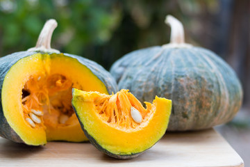 closeup fresh pumpkin slice on wooden table