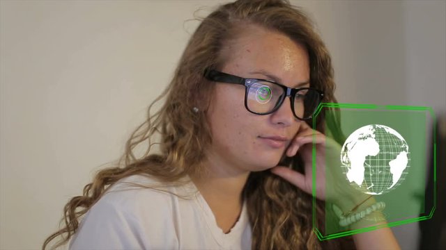 HUD Futuristic High Tech Planet Earth Digital Display Scanner, 4K Thoughtful young girl use a computer