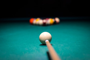 begin playing billiards, shot in white ball