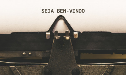 Seja bem-vindo, Portuguese text for Welcome on vintage type writer from 1920s