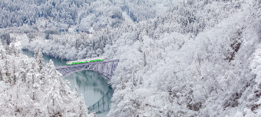 Obraz premium Japan mountain and snow with local train in winter season at Mishima town , Fukushima prefecture