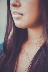 Sunny portrait of beautiful girl in a gray dress fitting