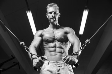 Fototapeta na wymiar Brutal caucasian handsome fitness men on diet training chest pumping