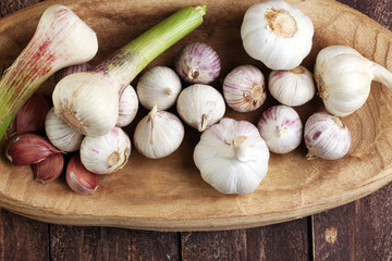 Garlic. Garlic Cloves and Garlic Bulb in vintage wooden bowl.
