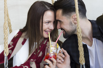 Young couple looking each other on eyes