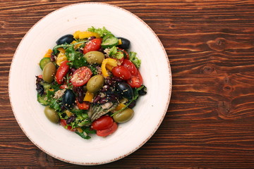 Tuna salad with cherry tomatoes, beans and olives. Low fat eating concept.