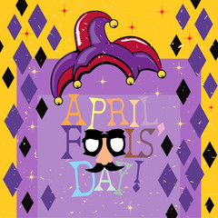 April Fools Day decoration with jester hat on a yellow and purple color scheme 
