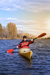 Traveling by kayak on the river on a sunny day.