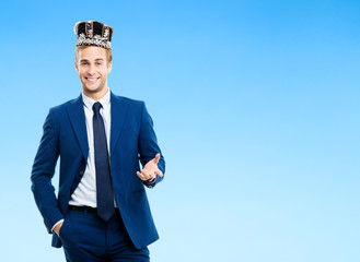 smiling young businessman in crown