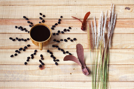 coffee on wooden panel table with natural object decoration.