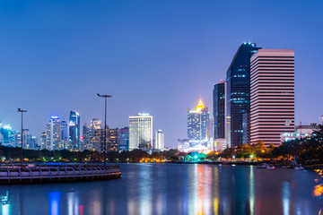 Fototapeta na wymiar Bangkok city downtown at night with reflection of skyline, Bangkok,Thailand