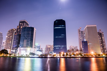 Fototapeta na wymiar Bangkok city downtown at night with reflection of skyline, Bangkok,Thailand
