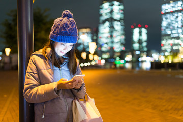 Woman use of mobile phone at yokohama night