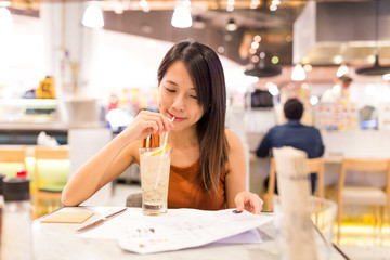 Woman enjoy her drink in restaurant
