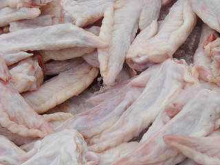 raw chicken wings sold in the market. Selective focus
