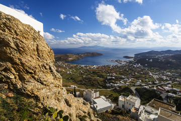 View of the harbor, Livadi village and Sifnos island in the distance from Chora, Serifos island in Greece. 