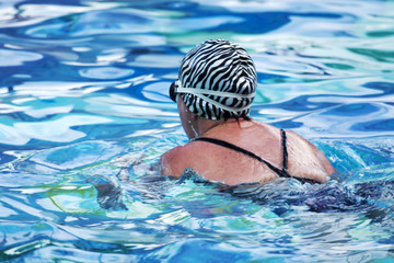 Swiming the breast stroke in a pool