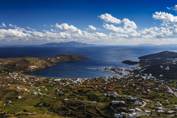 View of the harbor, Livadi village and Sifnos island in the distance from Chora, Serifos island in Greece. 