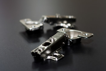 Door Hinge isolated on black background