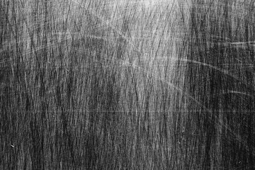 Abstract black and white scratched metallic surface.