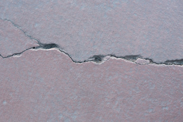 Grunge concrete cement floor with crack in building, great for your design and texture background
