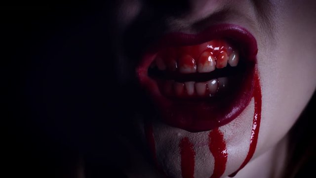 4K Horror Close-Up of Woman Lips in Blood Grimacing