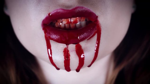 4K Horror Close-Up of Vampire Red Lips with Blood