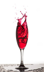 Glass with red wine splash