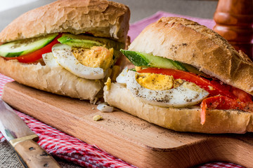 Egg Sandwich with black pepper, tomatoes and greens.