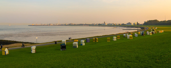 Cuxhaven Döse. Seaside cityview with bay of Grimmershörn at sunset - obrazy, fototapety, plakaty