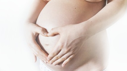 Pregnancy - pregnant woman - showing heart on belly