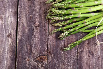 Bunch of fresh asparagus on wooden table