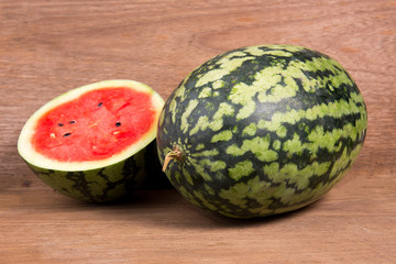 Tasty watermelon on brown wooden background
