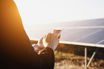 Engineers use phones in solar panels.