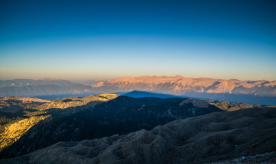 Fototapeta na wymiar view from the top of Tahtalı Mountain Range during sunrise on sea and valley, Turkey, Kemer